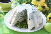 Herb cream terrine with eggs on peas