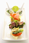 Appetiser platter with meat, fish and vegetables