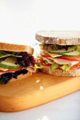 Two sandwiches on chopping board