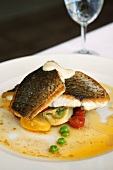 Snapper fillet with cherry tomatoes and peas