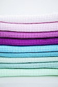 Pile of different-coloured tea towels