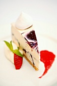 Piece of cheesecake with raspberry coulis