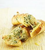 Garlic baguette with cheese and herbs