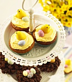 Cupcakes with Easter decorations on tiered stand