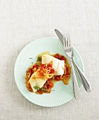 Cod with red pepper and onion sauce (overhead view)