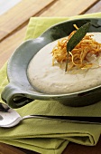 Artichoke soup with potato straw and sage