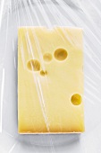 Hard cheese under clingfilm