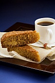 Two pieces of couscous cake with coffee