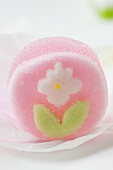 Pink jelly sweet with sugar flower
