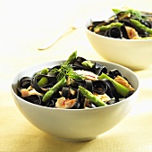 Squid ink pasta with salmon and green asparagus