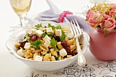 Pasta with dried tomatoes, sheep's cheese and parsley