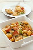 Baked gnocchi with cherry tomatoes, herbs and Parmesan