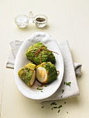 Boiled eggs wrapped in savoy cabbage leaves
