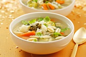 Minestrone with pasta, vegetables, pesto and Parmesan