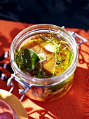 Pickled tuna with garlic and herbs