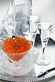 Salmon caviar and two glasses of vodka