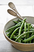 Green beans with almonds in ceramic bowl
