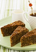 Pieces of walnut cake with maple syrup