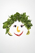 Gesicht aus Kräutern und Gemüse