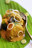 Fish curry on banana leaf