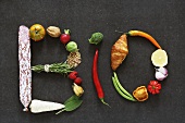 The word 'BIO' written in vegetables, fruit, herbs and other foodstuffs