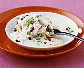 Spaghetti with four-cheese sauce and pink pepper