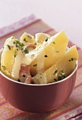 Potatoes with ham sauce and chives