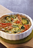 Colourful vegetable quiche in baking dish