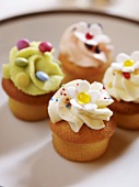 Mini cupcakes with coloured cream toppings