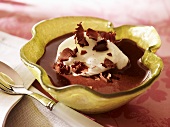 Chocolate cream with poached meringue and chocolate curls