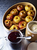 Baked apples with jam and cream
