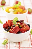 Marinated mixed berries and melon and orange salad