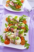 Mozzarella with Parma ham, tomatoes, basil and rocket