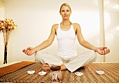 Woman in yoga position in meditation area