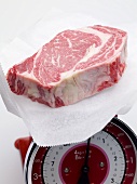 Beef steak on kitchen scales