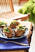 Baked potatoes with parsley sauce