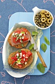 Bruschetta with tomatoes, ham and basil