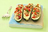 Courgettes stuffed with minced chicken, peppers and tomatoes