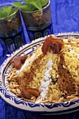 Seffa (sweet couscous) with cinnamon, dates and raisins (Morocco)