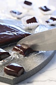Cutting chocolate caramels into squares
