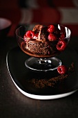 Brownie with chocolate ice cream and raspberries