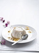 Vanilla and cinnamon panna cotta with passion fruit syrup