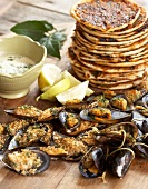 Grilled mussels with lime & coriander butter, toasted pitas with chermoula