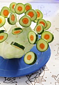 Vegetable lollipops stuck in a cabbage