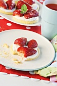 Strawberry shortcake with cream, partly eaten