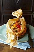 Salmon and vegetables in baking parchment