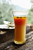 Carrot and apple drink with cardamom and honey