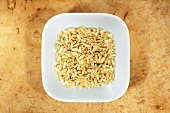 Long-grain brown rice in dish from above