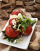 Baked tomatoes with green asparagus, goat's cheese and walnuts