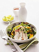 Salad with exotic fruit and chicken breast